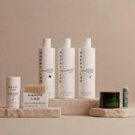 Collection of Happy Lad natural men's grooming products (The Clean Slate Bundle) on a neutral background